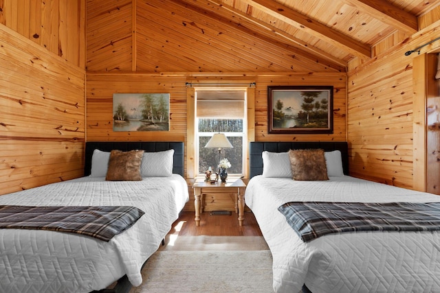 bedroom with wood finished floors, wooden walls, wooden ceiling, and vaulted ceiling with beams
