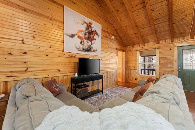 living room with beamed ceiling, high vaulted ceiling, wood finished floors, wooden walls, and wooden ceiling