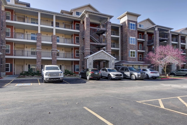 view of building exterior featuring uncovered parking