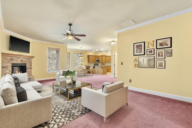 living area with baseboards, light carpet, ornamental molding, and a ceiling fan