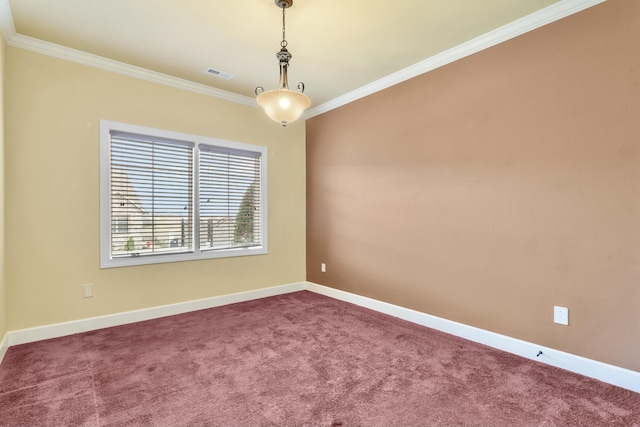 carpeted empty room featuring visible vents, crown molding, and baseboards