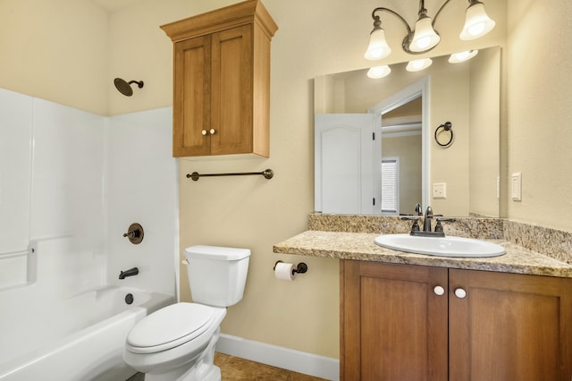 full bathroom with vanity, toilet, bathing tub / shower combination, and baseboards
