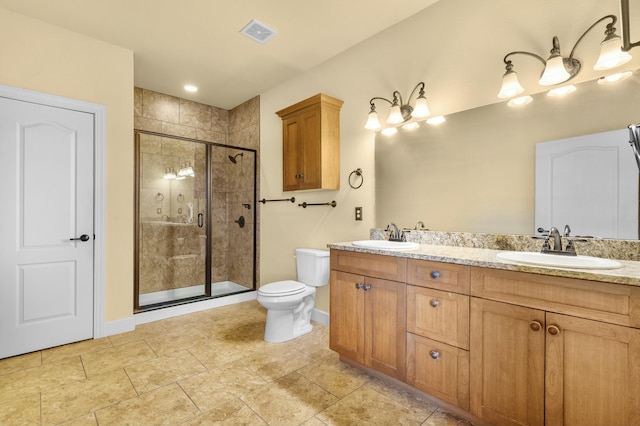 full bathroom featuring a sink, visible vents, toilet, and a shower stall