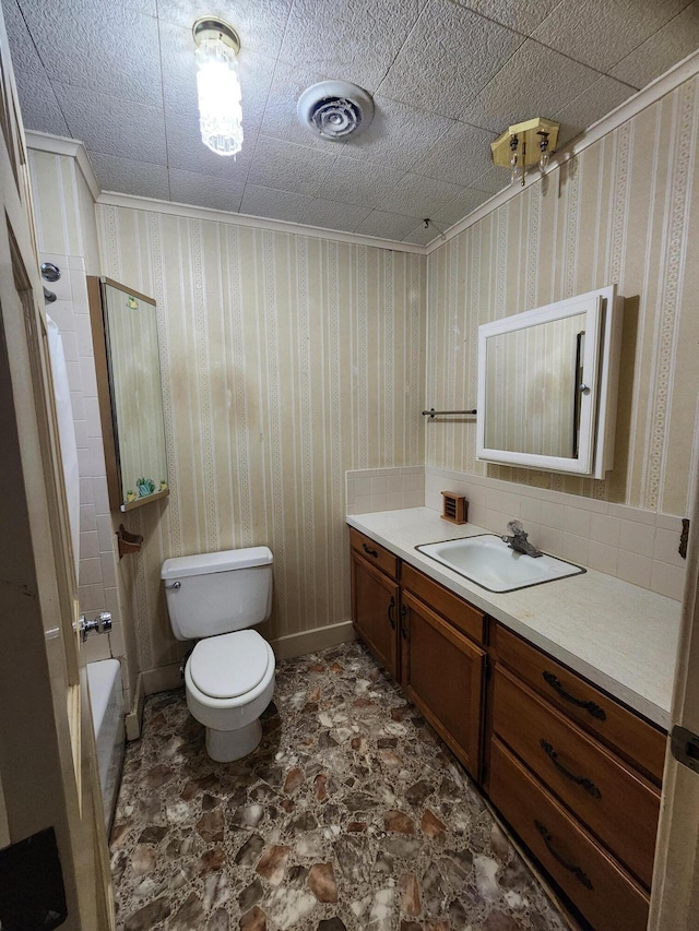 1622 W Fairview Ave, Carthage, MO 64836 - bathroom featuring vanity, toilet, and shower / bathtub combination