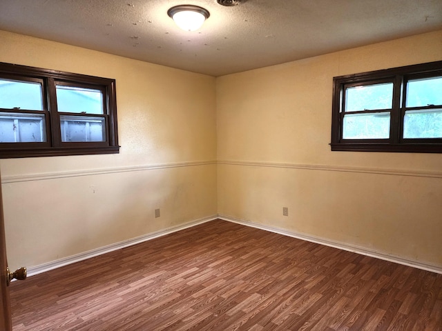 1622 W Fairview Ave, Carthage, MO 64836 - empty room with wood finished floors and baseboards