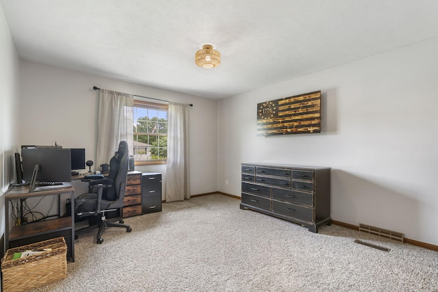 office space with visible vents, baseboards, and light colored carpet