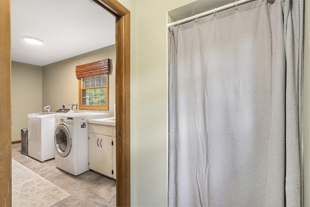 laundry room featuring washer and dryer and laundry area