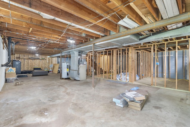 unfinished basement with electric water heater and heating unit