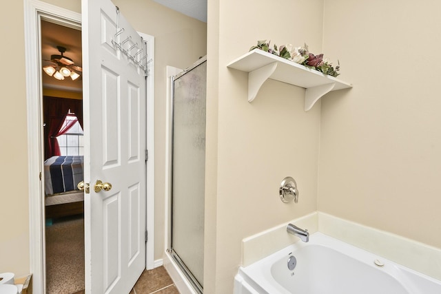 ensuite bathroom with ceiling fan, connected bathroom, a bath, tile patterned flooring, and a stall shower