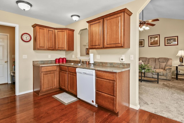 kitchen with a sink, a ceiling fan, dishwasher, and brown cabinets