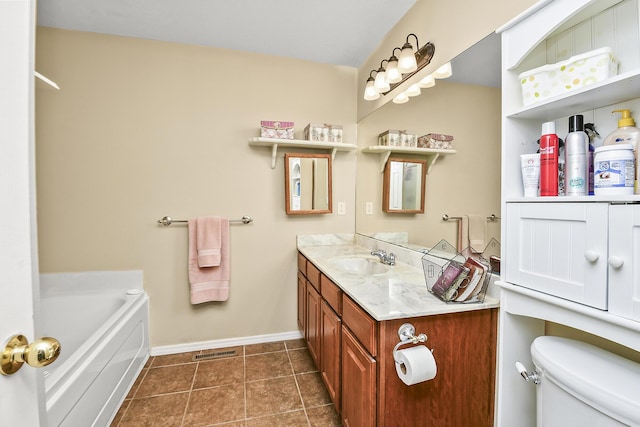bathroom featuring vanity, baseboards, tile patterned floors, toilet, and visible vents
