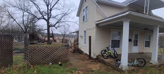 view of side of property with fence
