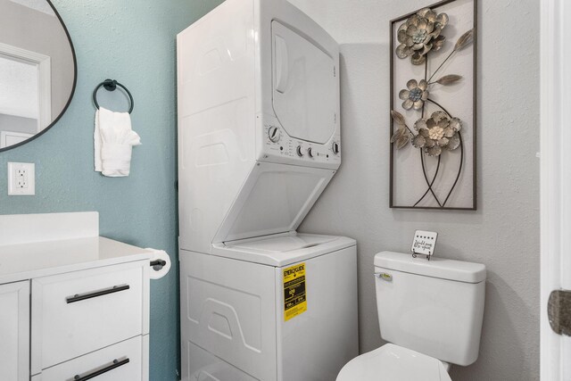 235 Ozark Mountain Resort Dr Unit 47, Kimberling City, MO 65686 - bathroom with stacked washer and dryer, vanity, and toilet