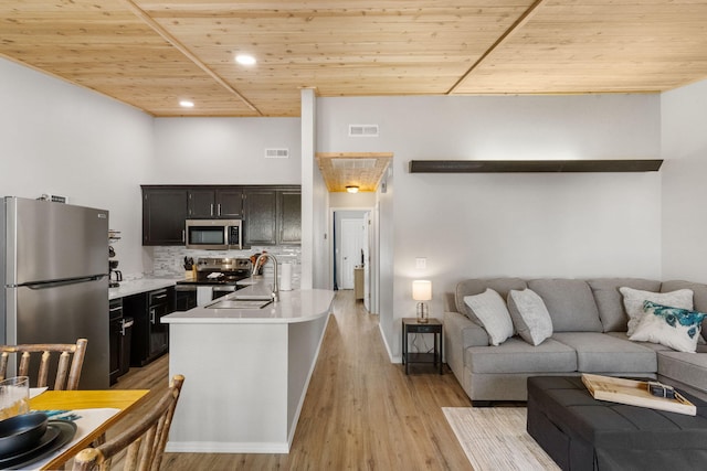 living room featuring wooden ceiling, recessed lighting, light wood-style floors, and visible vents