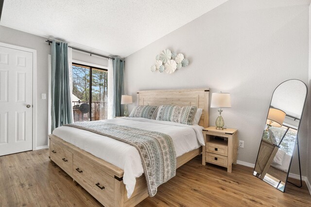 235 Ozark Mountain Resort Dr Unit 47, Kimberling City, MO 65686 - bedroom with lofted ceiling, access to outside, wood finished floors, and a textured ceiling