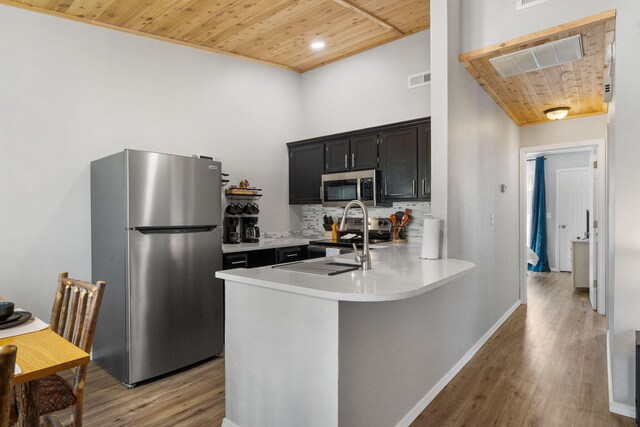 235 Ozark Mountain Resort Dr Unit 47, Kimberling City, MO 65686 - kitchen with appliances with stainless steel finishes, light countertops, wooden ceiling, and a peninsula