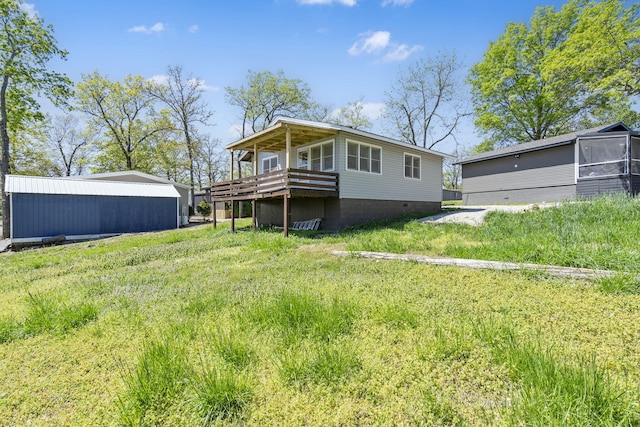 back of house with a wooden deck