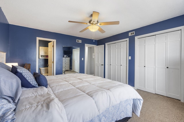 145 Starboard Dr Unit 8, Kimberling City, MO 65686 - bedroom featuring carpet, two closets, ceiling fan, and ensuite bathroom