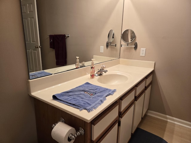 300 Port Dr Unit 5, Kimberling City, MO 65686 - bathroom featuring baseboards and vanity