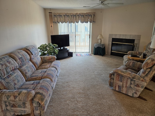 300 Port Dr Unit 5, Kimberling City, MO 65686 - living room featuring a fireplace, a ceiling fan, carpet, and a textured ceiling