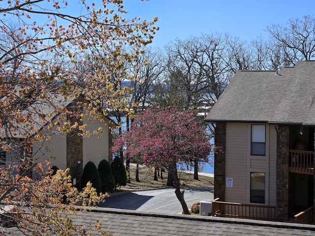 300 Port Dr Unit 5, Kimberling City, MO 65686 - view of home's exterior featuring roof with shingles