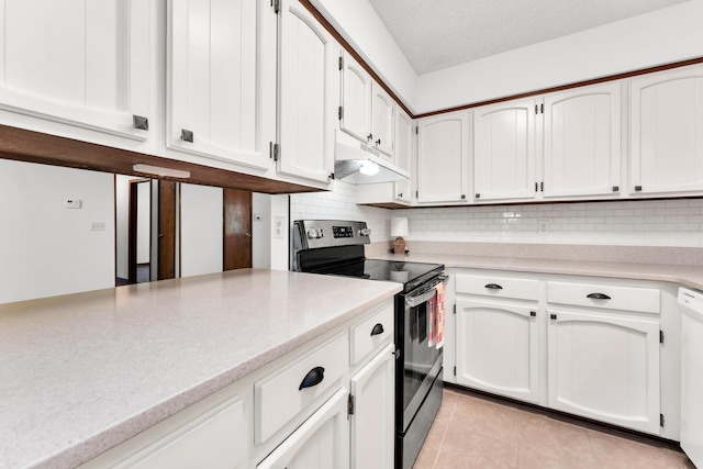 kitchen featuring light countertops, stainless steel range with electric stovetop, under cabinet range hood, and white cabinets