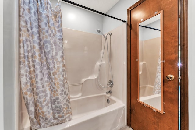 bathroom with shower / bathtub combination with curtain