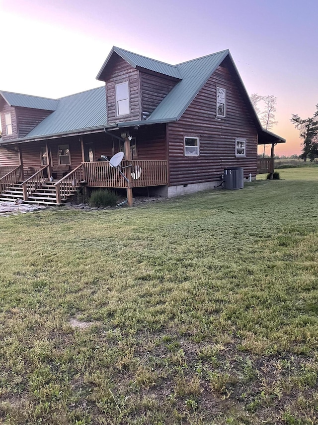 20302 Farm Rd Unit 1120, Cassville, MO 65625 - rear view of property with central air condition unit, a yard, metal roof, and a porch