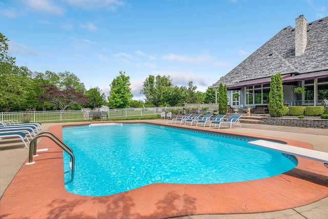 9041 N Country Manor Ln, Fair Grove, MO 65648 - view of swimming pool with a patio, fence, and a diving board