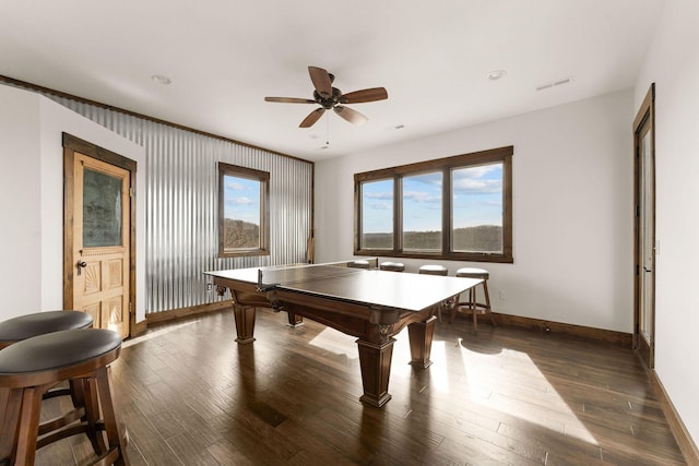 game room with visible vents, baseboards, a ceiling fan, and wood finished floors