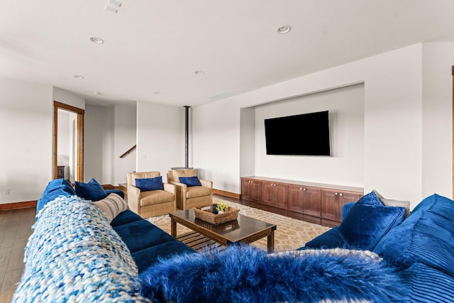 living area with hardwood / wood-style floors, baseboards, stairway, and recessed lighting