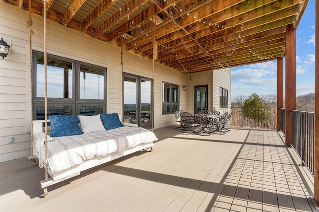 wooden terrace featuring outdoor lounge area and outdoor dining area