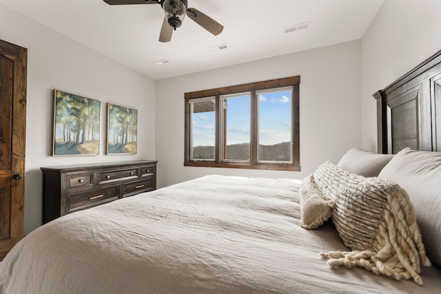 bedroom with ceiling fan and visible vents