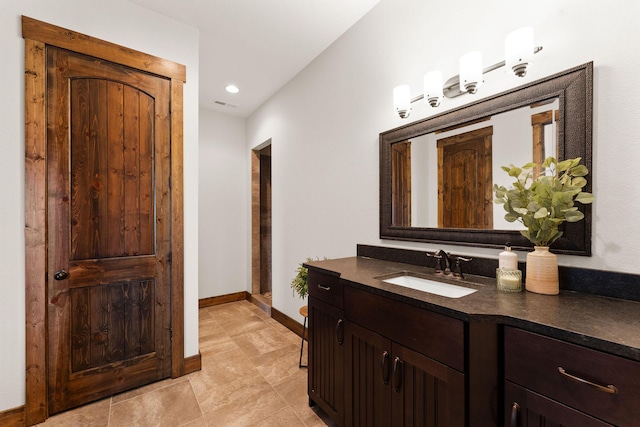 bathroom featuring vanity, baseboards, recessed lighting, tile patterned flooring, and visible vents