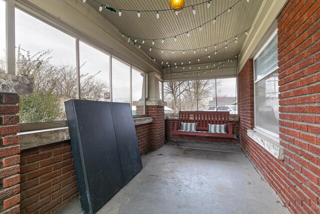 218 Lillian Pl, Bolivar, MO 65613 - sunroom / solarium featuring rail lighting