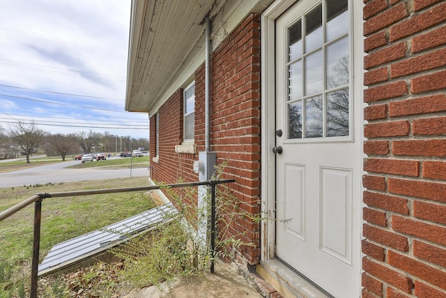 218 Lillian Pl, Bolivar, MO 65613 - view of exterior entry with brick siding