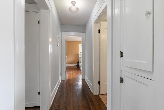 218 Lillian Pl, Bolivar, MO 65613 - hallway with baseboards and wood finished floors