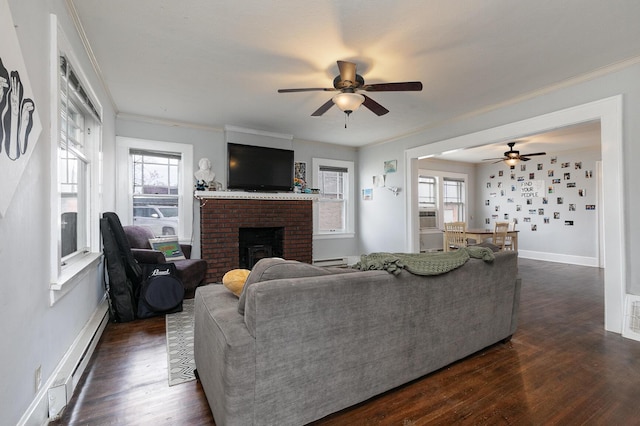 218 Lillian Pl, Bolivar, MO 65613 - living room featuring a ceiling fan, dark wood-style flooring, and a healthy amount of sunlight