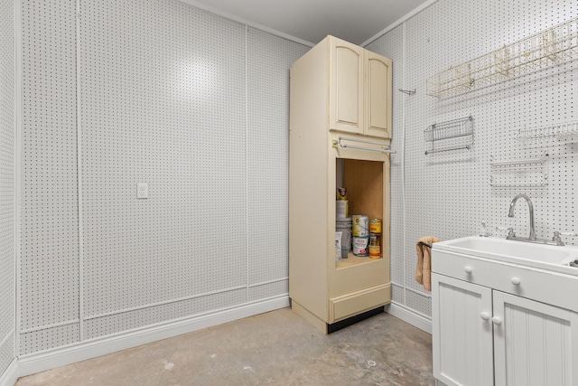 bathroom featuring baseboards, concrete floors, and vanity