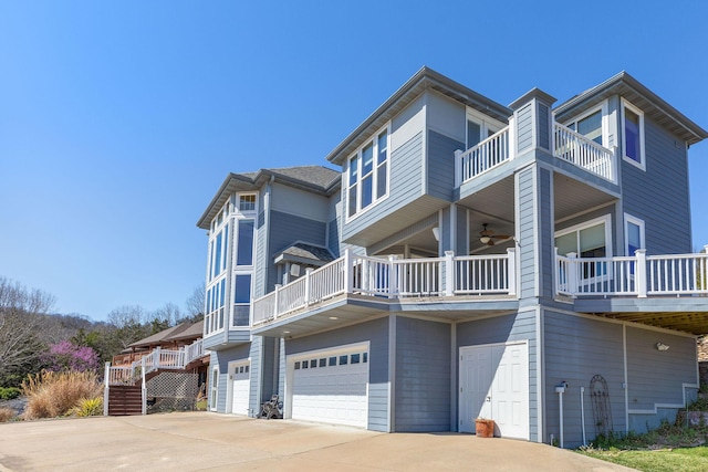 view of side of property featuring driveway and an attached garage