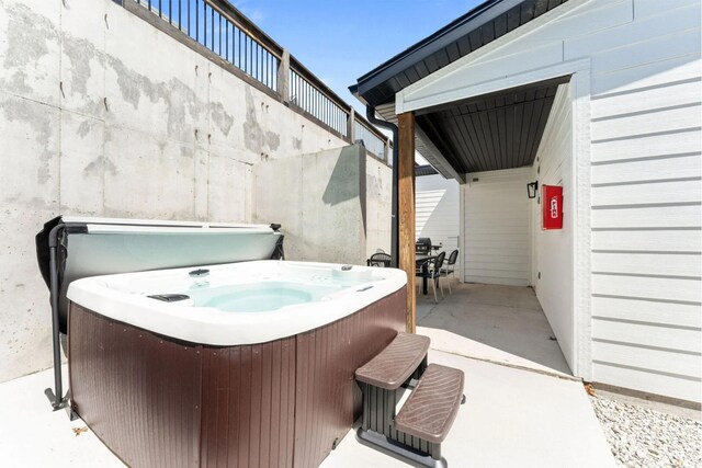 201-217 Watersound Way, Hollister, MO 65672 - view of patio with a hot tub