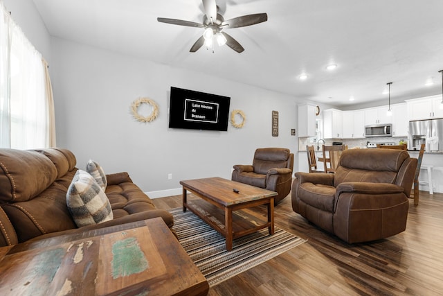 201-217 Watersound Way, Hollister, MO 65672 - living room featuring dark wood-style floors, ceiling fan, recessed lighting, and baseboards