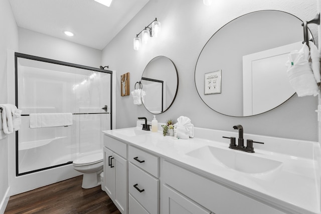 201-217 Watersound Way, Hollister, MO 65672 - bathroom featuring a sink, a stall shower, and wood finished floors