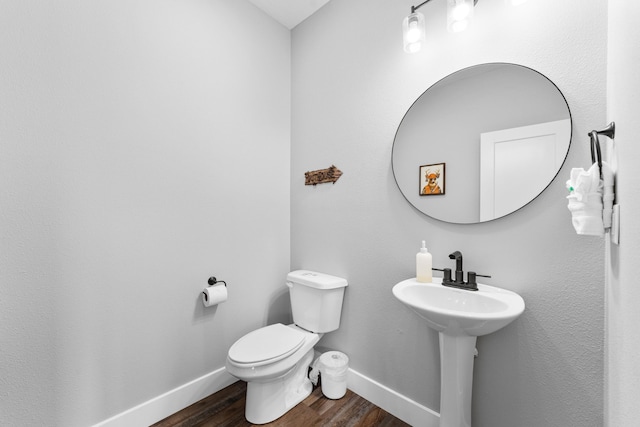 201-217 Watersound Way, Hollister, MO 65672 - bathroom featuring toilet, baseboards, and wood finished floors