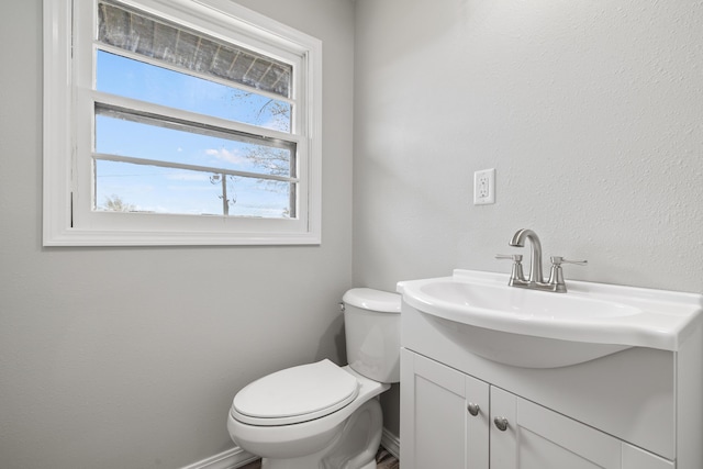 200 N Madison Ave, Mansfield, MO 65704 - bathroom featuring baseboards, toilet, and vanity