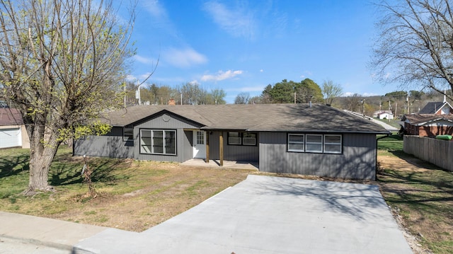200 N Madison Ave, Mansfield, MO 65704 - view of front of home with fence and concrete driveway