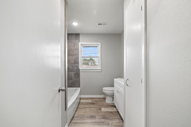 200 N Madison Ave, Mansfield, MO 65704 - full bathroom featuring baseboards, visible vents, toilet, and wood finished floors