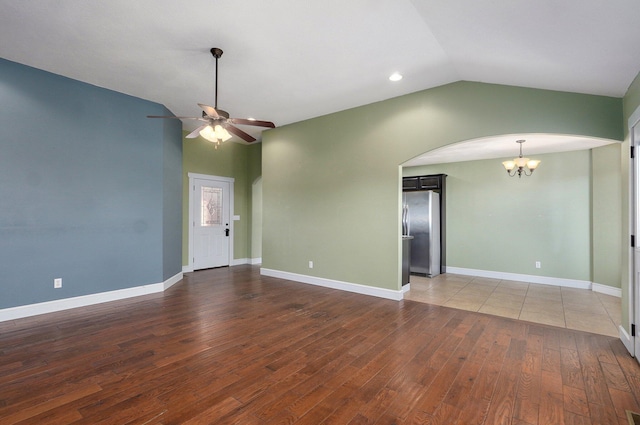 1471 Woodland Rd, Marshfield, MO 65706 - unfurnished room with a chandelier, lofted ceiling, ceiling fan, arched walkways, and wood finished floors