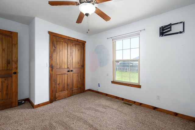 1471 Woodland Rd, Marshfield, MO 65706 - unfurnished bedroom with light carpet, a closet, and ceiling fan