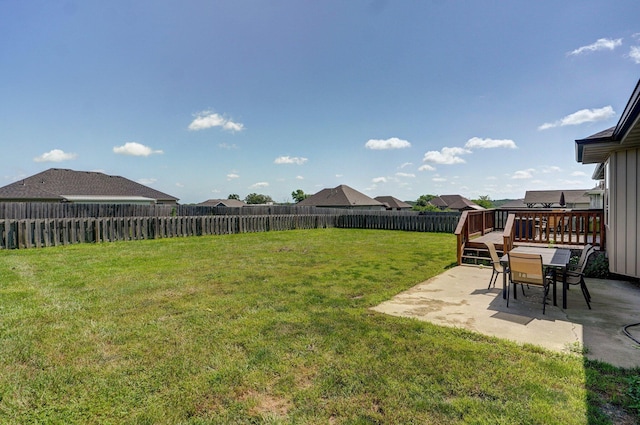1471 Woodland Rd, Marshfield, MO 65706 - fenced backyard with a patio and a wooden deck